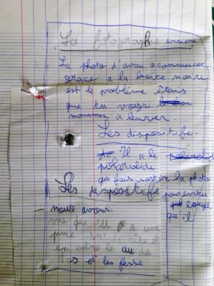 Prise de notes attentive de la part de Titouan 